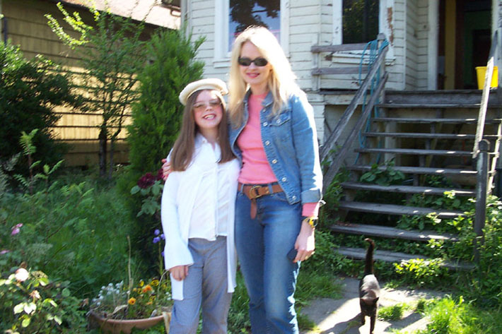 Sofia Angelina, with her mother mother, Deanna Angelina, in front of dad's house.
Approaching the camera is Nyra, the kitty.